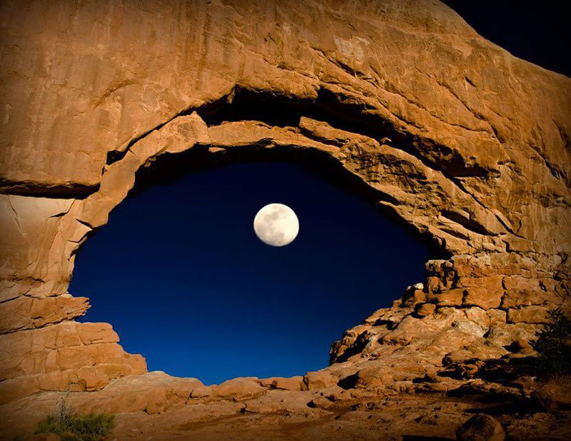 the moon through north window arches national park utah united states The 50 Most Perfectly Timed Photos Ever