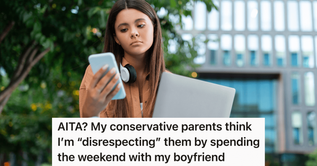 upset female college student looking at her phone