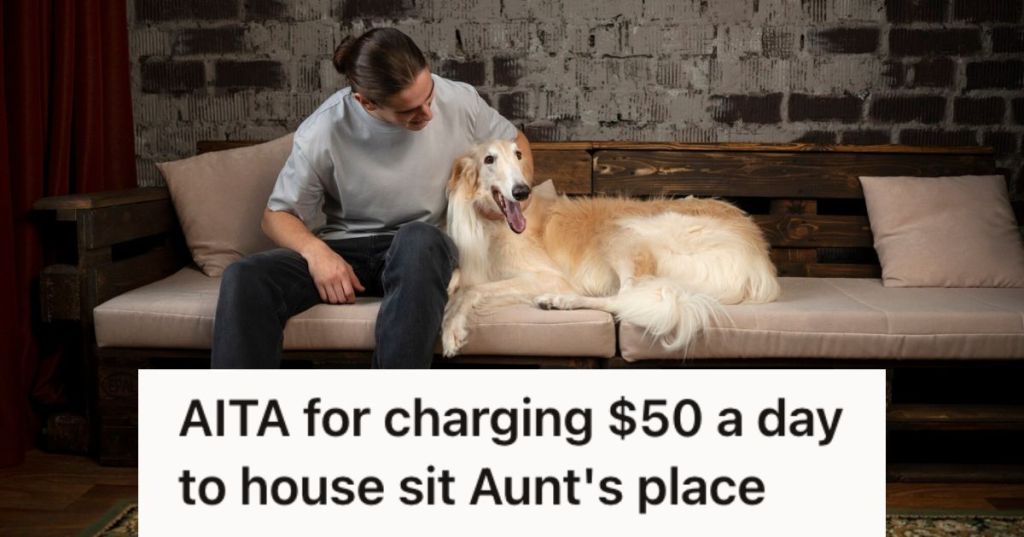 Man sitting on the couch and looking after his dog