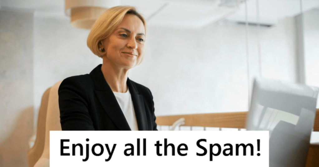 Business woman using a laptop and smiling
