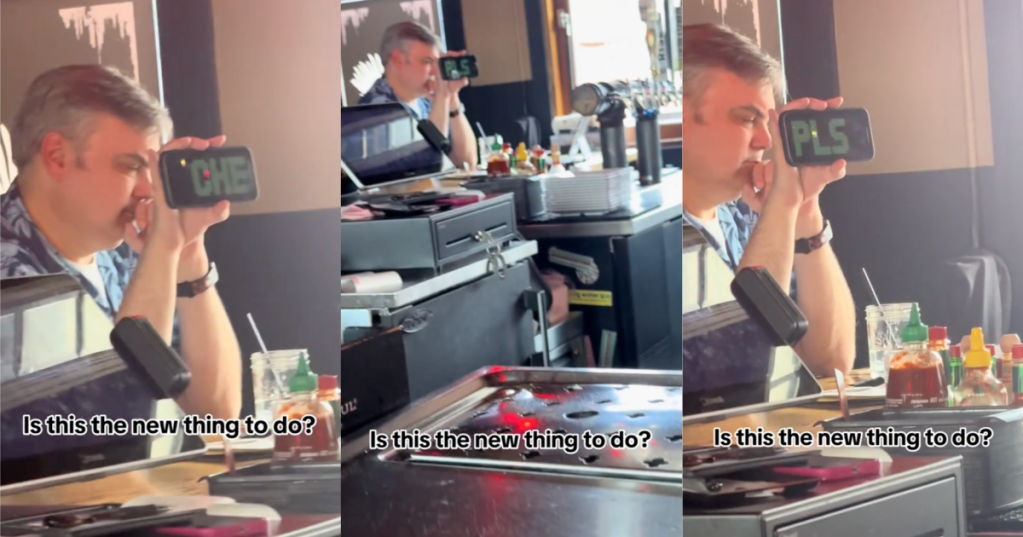 man sitting at a bar